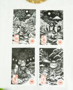 Estampes japonaises Yokai des saisons au format A6 : linogravures artisanales représentant un kappa, un tengu, un kitsune et un tanuki, imprimées à la main en noir, bleu et violet.